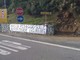 Lo striscione apparso nei pressi del casello autostradale di Celle Ligure